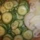 Thinly sliced cucumbers and onion.