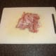 Cold ham is roughly chopped for readding to the soup