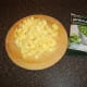 Chopped potatoes and frozen peas for soup