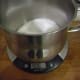 Dissolve white sugar in white vinegar