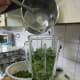 pour the warm sugar & vinegar liguid over the leaves whilst blending