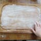 Lightly dust a clean, flat surface with flour.