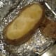 Make an oval cut on top of each potato and discard the removed piece of skin.