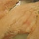 Raw catfish fillets are cleaned and ready for savory seasonings.