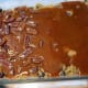 Blanket wth caramel sauce and pecans.