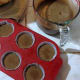 7. With the help of a measuring cup, pour cake batter into lined cupcake tins.