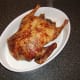 Duck is sat in an appropriate dish to rest
