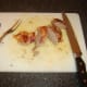 Duck breasts are sliced for service