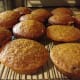 Freshly baked pumpkin muffins cooling on the rack.