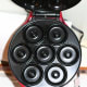 Inside of the mini donut maker. There's 7-mini donut forms. You only fill the bottom mold as they will expand.