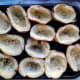 After potatoes are baked, cut in half and scoop out the potatoes to leave the skins.