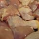 Washed and cut-up chicken legs are prepared for seasoning.
