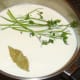 Parsley stalks and bay leaf added to milk