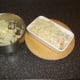 Mashed potato is spooned on to fish pie