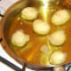 Peeled potatoes are added to hot oil
