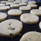 using a 3"cutter produces about 30 cookies. Place them on a baking sheet lined with a silicone sheet and bake.