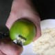 Use a zester and if you prefer, cut the zest to smaller pieces.