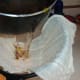 Pour the Tisane through a cheesecloth and discard the spent flowers.