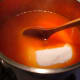 Step 5: Because your liquid is boiling, the sugar should dissolve rather quickly. Use the whisk again if the sugar has any lumps.