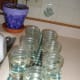 Set cleaned jelly jars on a kitchen towel and fill with boiling water.