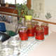 Step three: Tip the jars upside down as you finish screwing the lids on. They will sit this way for 5 minutes.