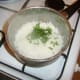 Parsley is stirred through cooked rice