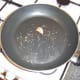 Garlic and thyme add flavour to the oil for frying pigeon breasts