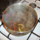 Beef stock and red wine is added to browned meat