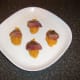 Pigeon breast halves are laid on sweet potato quenelles