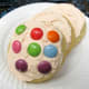 Decorate sugar cookies with brightly colored candies or sprinkles.