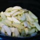 Lay the sliced apples in the slow cooker.