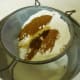 Sifting the spices with the flour