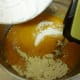 Blending the dry ingredients with the wet ones.