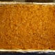 Carefully spread the cooled frosting over the caramel covered brownies.