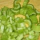 Step 3: Chop the celery and saute in butter until softened.