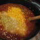 Add the veggies, pulled pork, and chicken.
