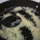 Step 3: Add the rice to the skillet.