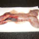 Drying washed rabbit before it is prepared for cooking