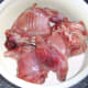 Rabbit pieces are added to seasoned flour