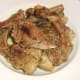 Rabbit and pork pieces are removed from pot