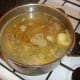 Chicken stock is added to cover rabbit and pork