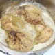 Browning rabbit pieces in butter