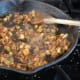 adding tomato paste and fresh garlic