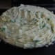 mashed potatoes placed on top in an even layer, and run over with a fork for nicer browning