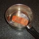 Preparing to poach salmon fillet
