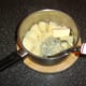 Mashing potatoes with plenty of butter