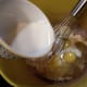 Add 4 eggs and 5 oz evaporated milk.