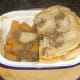 Cutting mince, tattie and neep pie for service