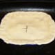 Glazed and vented pie is ready for the oven