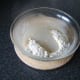 Water and melted lard poured in to well in the flour